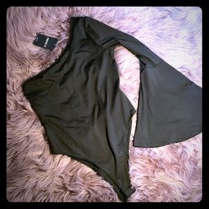 Black half sleeve body suit.